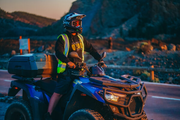 Guy on a quad with the sunset