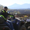 Man sitting on a quad with Mount Teide behind him!