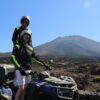 Couple posing on a quad in front of Mount Teide in Tenerife