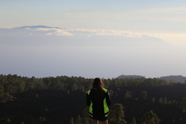 Lady staring at the view of La Gomera on Teide during the quad sunset tour