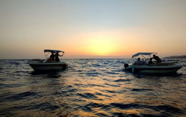 two self hire boats in the sunset in Tenerife